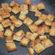 Step three: Saute breadcrumbs in butter or olive oil. Transfer them to a plate.