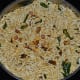 Step three: Add puffed rice to the above mix and add salt. Mix well. Stir the mix over very low fire for 1-2 minutes. Turn off the fire. Allow it to cool. Add sugar powder to balance the taste.