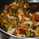 Step seven: Add all the fried ingredients to the pan. Mix once again. Let the heat be very low.