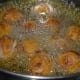Step five: Heat oil for deep-frying. Drop the balls one by one into the hot oil. Fry them over medium-high fire in the beginning. Turn them occasionally. Lower the heat after 2 minutes.