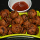 Step nine: These crunchy and yummy onion fritters are hot and inviting! Serve them with tomato sauce or a cup of coffee or tea. Enjoy!