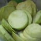 Peeled eggplant in lemon water.
