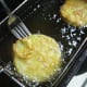 Place into dip fryer. Let egg set for a couple seconds.