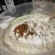 Mixing in the dry ingredients.
