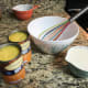 Condensed soup, milk, bowl, and whisk.