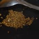 Step two: Saute cumin seeds in oil. Let them crackle.