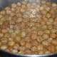 Observe, in the last stages of frying, chickpeas float on the surface