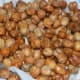 Step five: Take them out and place on an absorbent paper towel. Repeat the same for frying all the chickpeas.