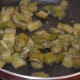 Step two: Cook the chopped eggplant in some oil and water.