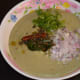 Step five: Add chopped onions and finely chopped coriander leaves. Add the tempering.