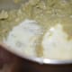 Add yogurt or thick curds. Pulse the mixer once. Add it to a mixing bowl.