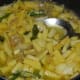 Step seven: Pour in a cup of water. Cover the pan. Cook till potato becomes soft, but not mushy. Add chopped coriander leaves and lemon juice. Mix well.