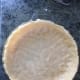 Pastry pressed into greased dish.