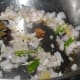 Step two: Throw in chopped onions, slit green chilies, and crushed ginger-garlic. Saute till onions turn golden.