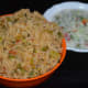 Step nine: Spiced cabbage rice is ready to serve. Eat it with cucumber-onion raita on the side. Enjoy!