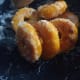 Coat the donuts with the sugar.