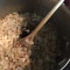 Saute diced onion and butter in a stock pot until the onion is tender and golden brown.