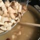 Add the chopped vegetables (potatoes, carrots, and celery), then allow the soup to come to a full boil. Cook for approximately 20 minutes on medium-high heat, stirring occasionally.