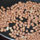 Step one: Fry peanuts until they become crispy.