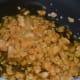 Step five: Heat jaggery in the same pan. Add 2 tablespoons of water.