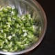 Wash the bitter gourd, remove the inner part, and discard. Chop the outer part.