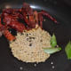 Heat oil in a pan. Add the sesame seeds, white lentils, coriander seeds, curry leaves, hing powder, and broken dry red chilies.