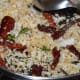 Stir-fry until the coconut becomes golden-brown then put aside to cool.