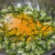 Apply the salt and turmeric and mix well. Keep aside for 20 minutes. Afterwards, squeeze out the water. Discard this bitter water and collect the dry bitter gourd pieces.