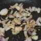Step one: Saute cumin seeds and pepper corn in butter or oil. Cumin crackles. Add chopped onions. Saute till they become pinkish and transparent.
