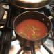 The marinade being reduced to a sauce. I would recommend a larger saucepan.