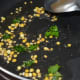 Step one: Saute mustard seeds, cumin seeds, curry leaves, split chickpea, and white lentils in oil till the mustard seeds sizzle.