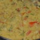 Step four: Add a teaspoon of ghee, grated coconut, and finely chopped coriander leaves. Mix thoroughly. Turn off the stove.