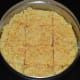 Step nine: Observe that the mix becomes a darker color due to the high heat inside the bowl. Cut it into square pieces with the help of a greased knife. Carefully take them out one by one.