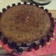 The side of the chocolate sponge cake was brushed with melted chocolate. Then the chocolate bars were cut into half and pasted them on the wet side of the sponge cake.