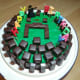 Then blocks of yummy chocolates were put on top making a circle and yes, just like building blocks of chocolates. A small warrior and a sword of Minecraft was added to the decorations. Then happy birthday candles on the cake.
