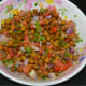 Step five: Gently mix. The black chickpea chat or salad is ready to serve!