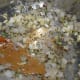 Heat oil and ghee in a pressure cooker base. Add the mustard seeds and cumin. Sauté until the mustard splutters. Throw in whole garam masala spices. Add onions and add ginger-garlic-green chili mix. Sauté for 2 minutes.