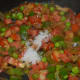 Step five: Add salt. Mix well. Cover the lid and cook for two minutes.