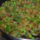 Step three: Throw in green peas and chopped capsicum. Saute for 3-4 minutes.
