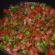 Step four: Add chopped tomatoes. Stir-cook on a high flame for 3 minutes or till they become soft, not mushy. Add some water to keep the mix moist.