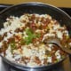 Step eight: Add some finely chopped coriander leaves. Mix well. Combine the spices with the paneer.