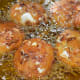 Step four: Deep-fry the balls in batches of 4-5. Fry them till golden brown. Place them on a tissue paper.