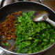 Step five: Add chopped fenugreek leaves. Mix well with the seasonings. Cover and cook till they are done.