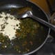 Step seven: Add roasted gram flour. Stir the mix continuously. Add remaining salt. Sprinkle a few drops of water to prevent the curry from becoming too dry.