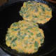 Step four: Heat a pan. Add some oil. Pour 1 1/2 tsp batter on it. Spread it a little. I cooked 2 pancakes at a time. Add a few drops of oil on the surface.