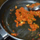 Step nine: Add sugar and salt. Mix well. Saute for a minute.