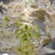Step two: Heat oil in a skillet or pressure cooker base. Add cumin seeds. Let them splutter. Add bay leaves. Throw in onion julienne. Saute till they turn translucent. Add minced ginger-garlic-green chili. Saute for two minutes.