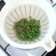 Peas are drained and seasoned