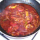 Vindaloo sauce is gently simmered