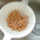 Chickpeas are rinsed in cold water